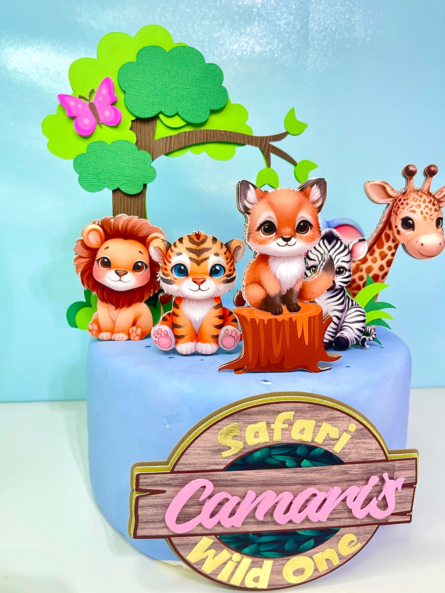 "Custom Wild One Cake Topper with Safari Animals by BeePaperParty" "Handcrafted Wild One Birthday Cake Decor with Jungle Animals" "Premium Quality Wild One Party Cake Topper featuring Safari Wildlife" "Colorful Jungle Theme Wild One Cake Topper by BeePaperParty" "Unique BeePaperParty Wild One Cake Topper with Safari Animals"